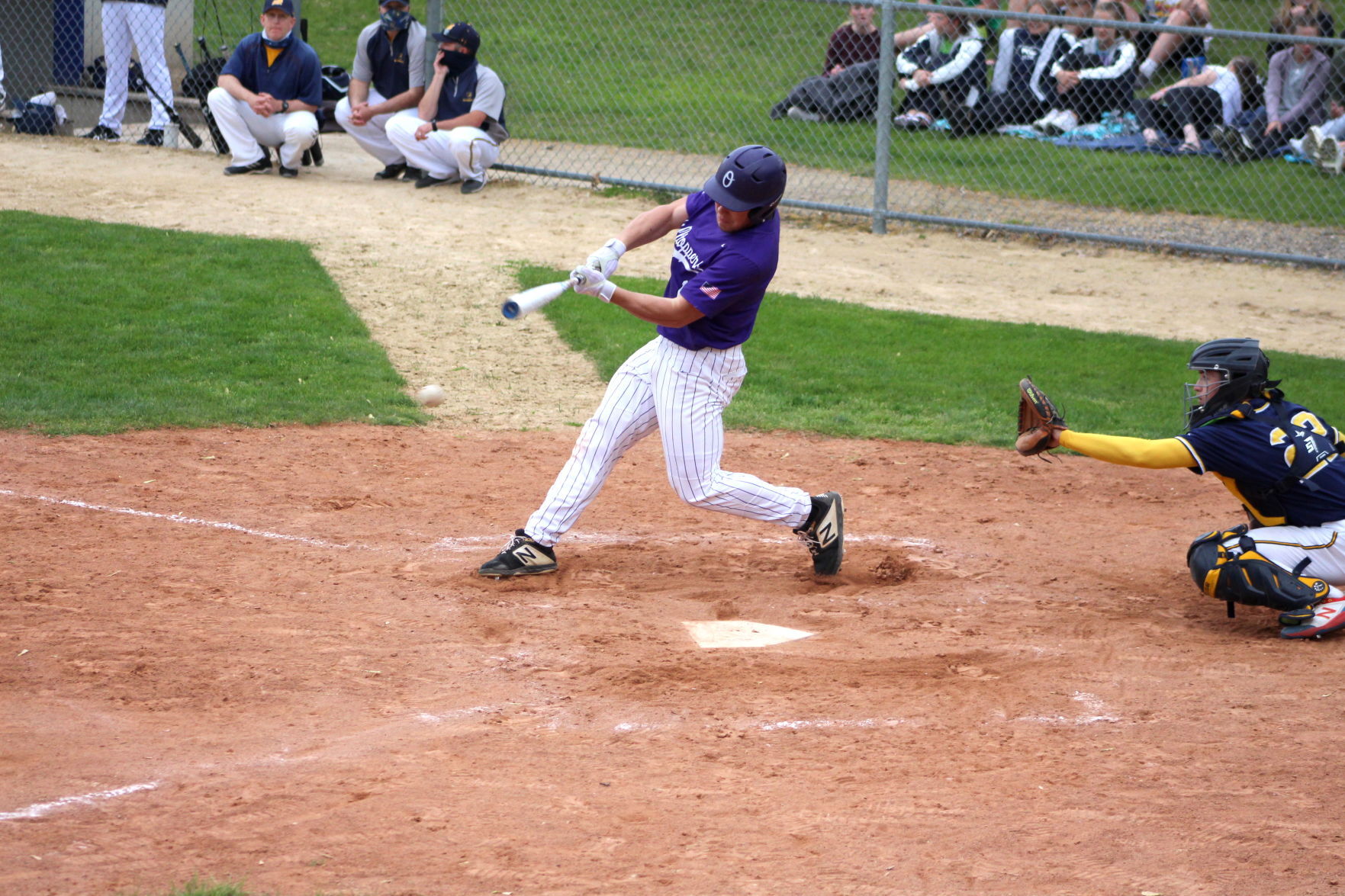 Sam Pica hits a pitch